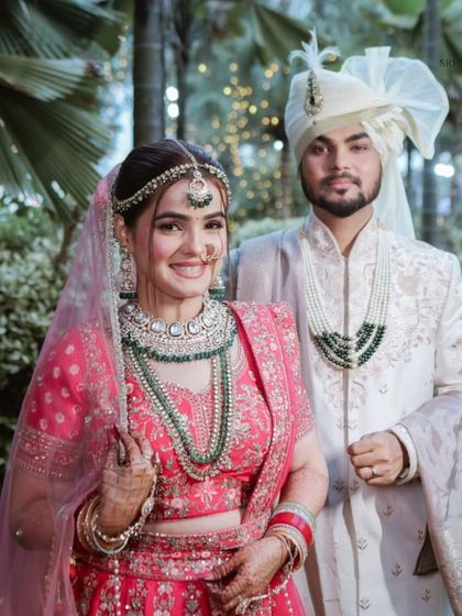 Another happy couple from our client diaries. The bride chose a stunning pink lehenga and a multi-layered Kundan set for a grand and festive wedding look.