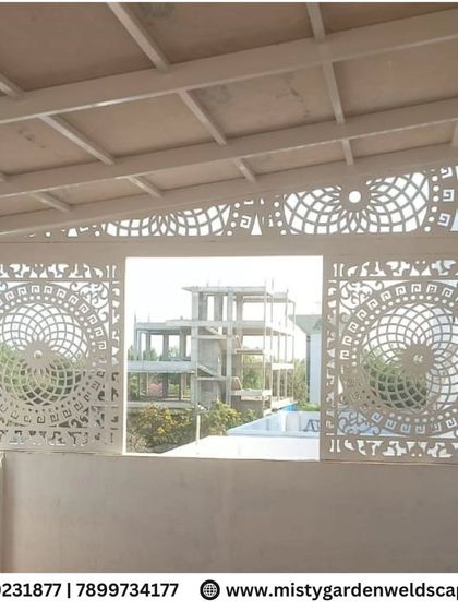 A close-up of the elegant CNC designer frames installed at a project in Hoskote. The intricate, circular pattern adds a sophisticated touch and serves as a beautiful privacy screen.