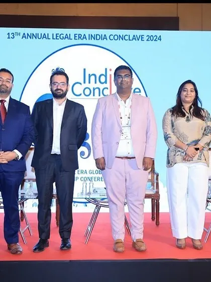 The panelists pose for a group photo after a successful discussion at the Legal Era India Conclave. Our firm's involvement in such events highlights our leadership in corporate and commercial law.