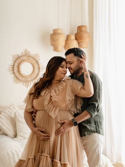 I love the tender connection in this photo. The couple is framed by the warm, natural textures of my boho studio setup, and her ruffled beige gown adds a soft, romantic touch to this intimate moment.