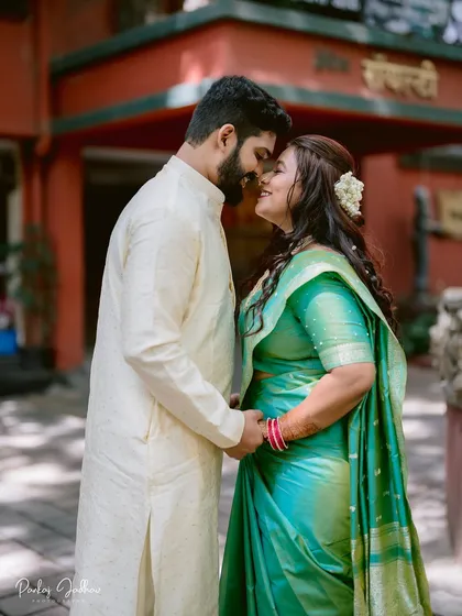 A moment of pure connection for Nidhi and Aditya. The gajra in her hair and the traditional attire create a portrait that is both intimate and culturally rich, captured during their Pune engagement.