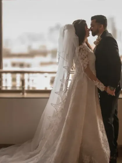 A beautiful silhouette of the couple against a window, celebrating their first anniversary. This shot is all about romance and timeless elegance.