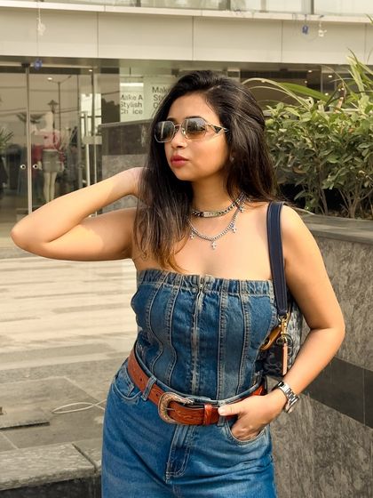 Denim on denim with a Y2K twist. I've paired a denim tube top with wide-leg jeans and added a chunky belt and layered necklaces to capture that early 2000s Bollywood-inspired vibe.