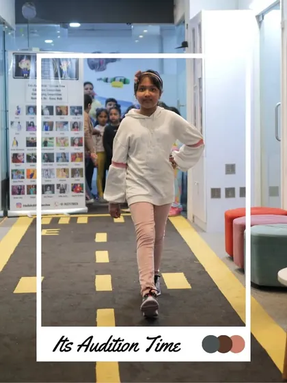 This young model is focused as she practices her walk. Every step on this practice runway is a step towards the big stage.