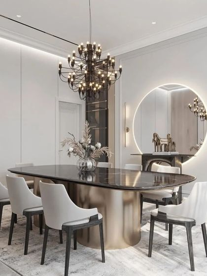 This shot focuses on the elegant details of the dining area, from the metallic base of the table to the simple yet beautiful floral arrangement.