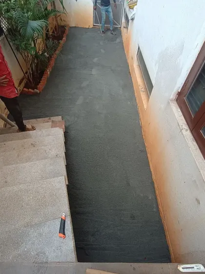 The base is now fully prepared and compacted, ready for the artificial turf to be rolled out. This view is from the top of the stairs.