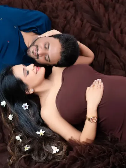 An intimate overhead shot of the couple lying together. This unique perspective captures a tender moment of connection and relaxation.
