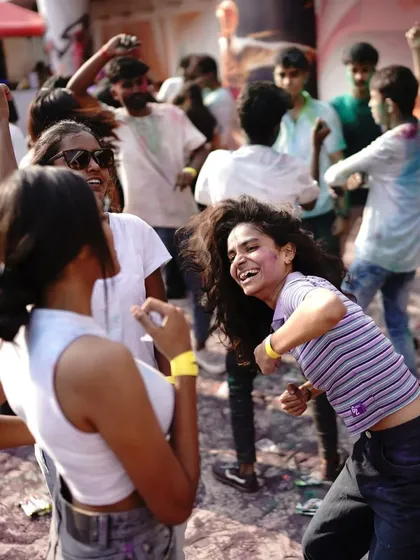 Candid smiles and laughter from the crowd at the Holi festival. These are the moments that make it all worthwhile.