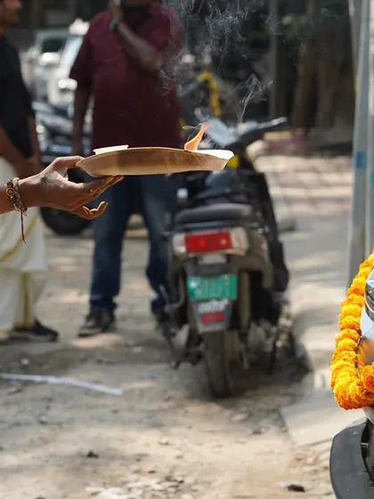 A priest performs a traditional ceremony for our patrol vehicles during Ayudha Pooja. This celebration reinforces our dedication to using our tools for the safety and well-being of others.
