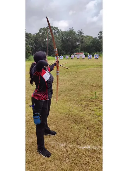 A student demonstrates her form with an Indian round bow during the CISCE Regional competition.