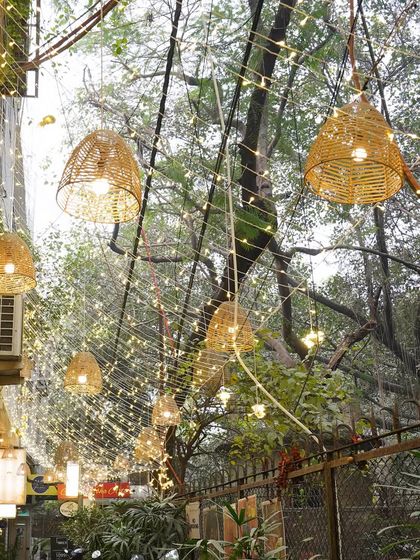 The entrance to my Hauz Khas Village location is adorned with enchanting lights and natural textures, setting a tranquil mood before you even step inside.