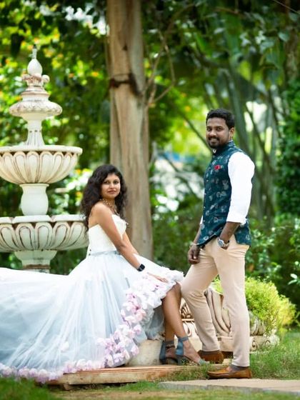 This couple's photoshoot in a beautiful garden has a relaxed and elegant feel. The high-low gown is a great choice for showing off stylish shoes.