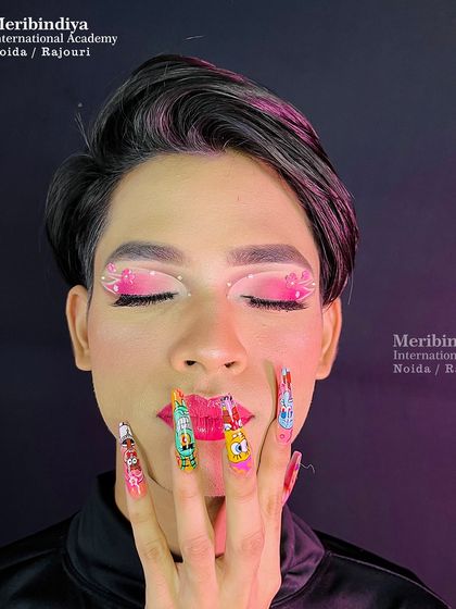 A fun pose that highlights the incredibly detailed and colorful cartoon characters painted on the nail extensions.