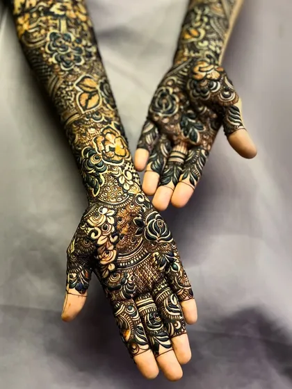 A beautiful example of a full-coverage design with a mix of dark and light shading, a technique that adds depth and dimension.