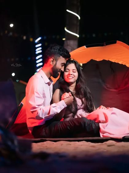 A sweet and romantic portrait from the camping shoot. The groom-to-be whispers to his partner, creating a candid and heartfelt moment.