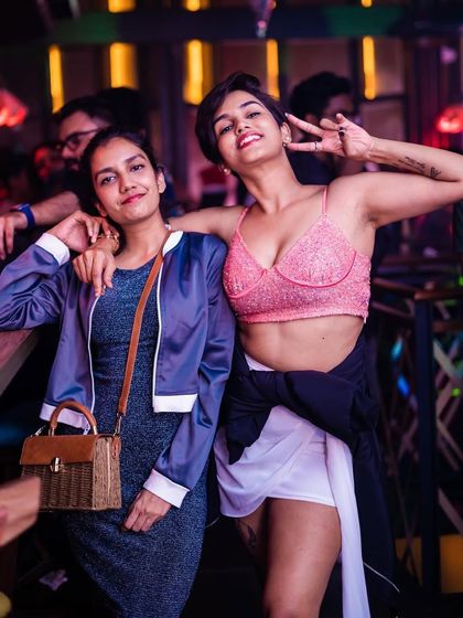 A guest looking stylish and enjoying the party atmosphere.