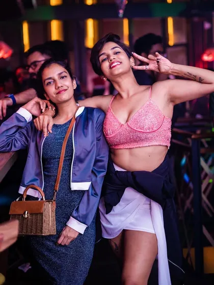 A guest looking stylish and enjoying the party atmosphere.
