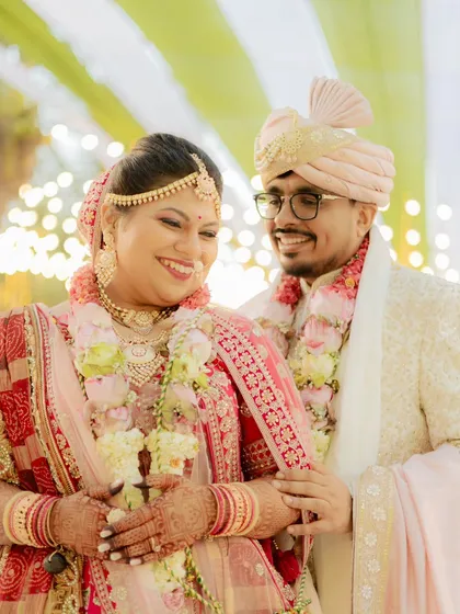 The laughter and joy right after the ceremony. This candid couple portrait captures the genuine happiness and comfort they find in each other's arms.
