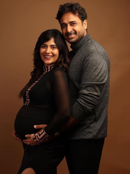 A classic couple's portrait filled with warmth and happiness. We love capturing the shared smiles and excitement as you prepare for your little one's arrival.