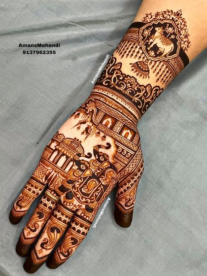 A full view of a complex design featuring a cow motif on the wrist and an elephant figure on the palm. The entire hand is covered in intricate architectural and floral patterns.