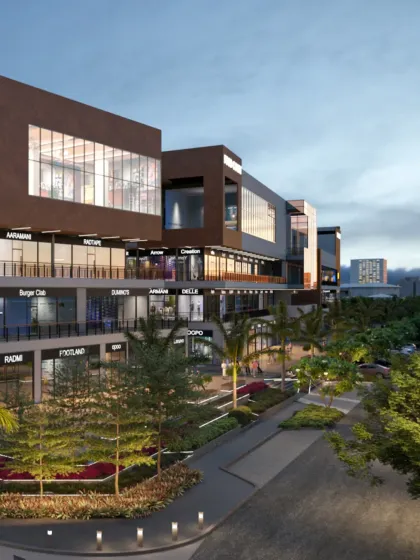 The V'lante retail destination in Gurugram, seen here at dusk, is designed to be a landmark. The architecture uses clean lines, varied massing, and strategic lighting to create an inviting and immersive urban experience that blends retail with community spaces.