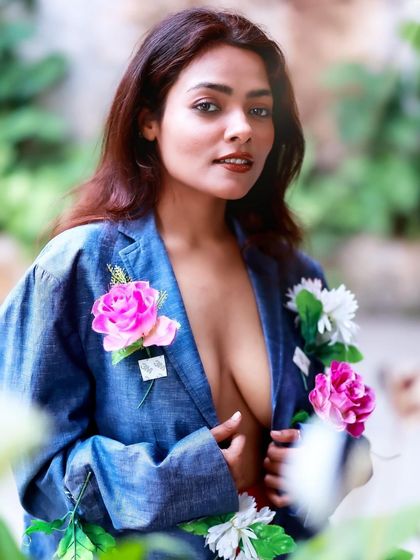 An outdoor version of the floral blazer concept. The natural light and green background add a new layer of organic beauty to the shot.