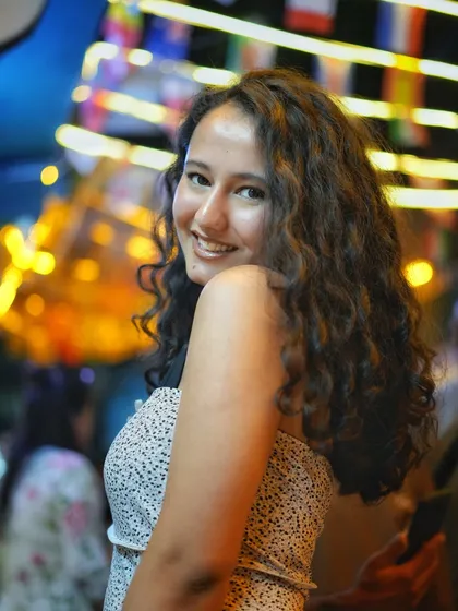 Night shoots in Delhi have their own vibe. Here on the streets of Majnu Ka Tila, I used the vibrant city lights to create this beautiful bokeh effect, making the portrait pop. It’s all about capturing that genuine smile against a lively background.