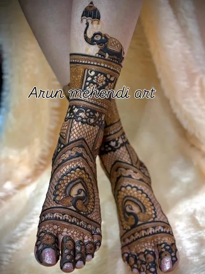 Your feet deserve beautiful art too. This bridal foot mehendi features elegant peacock and elephant motifs, designed to look stunning with your wedding footwear and for all the ceremonies.