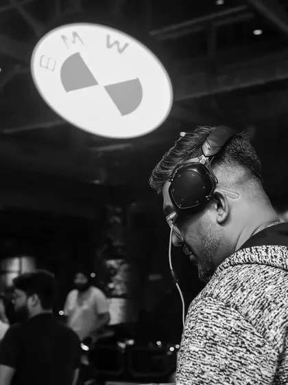 A black and white shot of me in the zone at the BMW event. Even at corporate gigs, my focus is always on delivering the perfect musical experience.