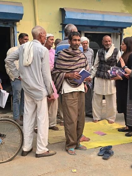 Engaging with villagers during a mobile legal awareness campaign. These grassroots interactions are essential for understanding the real-world challenges people face and offering relevant legal solutions.