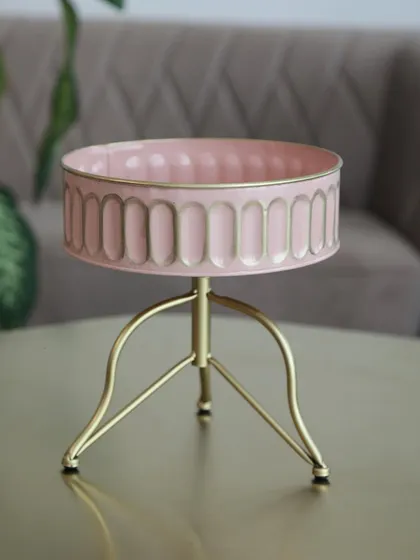 This unique pink and gold serving bowl on a tripod stand is a modern and playful addition to our collection. It’s perfect for serving snacks or as a decorative catch-all bowl.