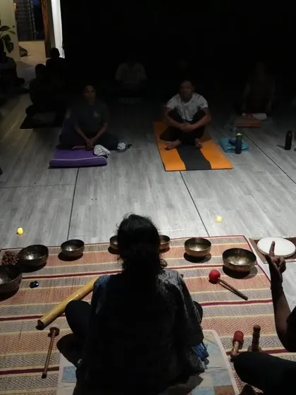 A glimpse into the serene atmosphere of our sound healing workshops. In the gentle glow of candlelight, we use Tibetan singing bowls to create a soundscape that calms the mind and balances your energy centers.