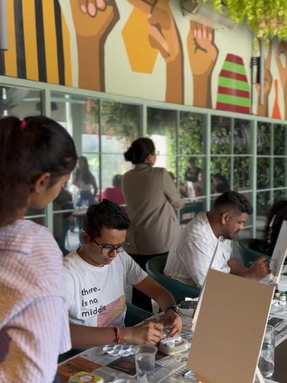 In my element, helping a participant with their color palette. I believe art is a form of therapy and self-expression.