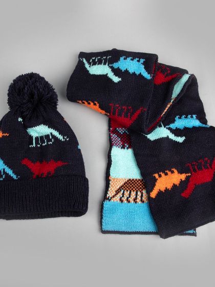A kids' winter beanie and scarf set with a colorful dinosaur pattern.