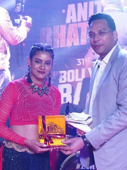 Receiving a token of appreciation after performing at a corporate New Year's gala. It's always rewarding to be recognized for bringing energy and entertainment to an event.