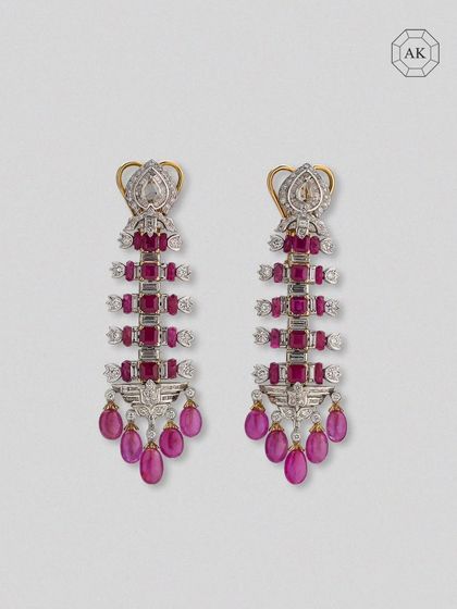 A full view of the ruby and diamond statement earrings, showcasing their power and intricate design.