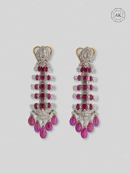 A full view of the ruby and diamond statement earrings, showcasing their power and intricate design.