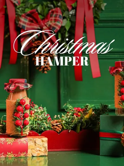Unwrapping the magic of the holidays with our classic Christmas Hamper. This festive collection, set against a rich green backdrop, includes our popular hot chocolate bottle and other seasonal goodies.
