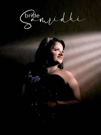 A dramatic solo portrait of the bride, using a single beam of light to create a spotlight effect that is both artistic and flattering.