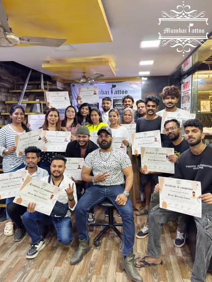 This is the goal. A group of our latest certified piercers, holding their certificates of completion. We are incredibly proud of our students and love seeing them ready to start their professional journey with the right skills and knowledge.