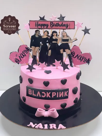 A Blackpink theme cake for a K-pop fan. This pink and black cake features the band's logo and members, perfect for a stylish birthday party.