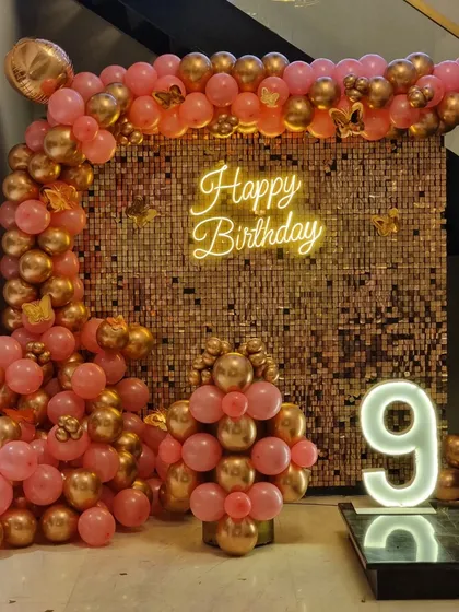 Another view of the 9th birthday setup, showing the butterfly accents on the balloons.