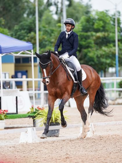 Another one of my riders demonstrating excellent form and posture during a dressage competition. The focus and poise shown here are key elements of my training philosophy.