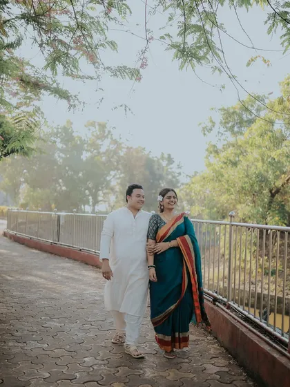 A happy walk together, arm in arm. This candid shot in traditional attire is full of warmth and the promise of a shared life.