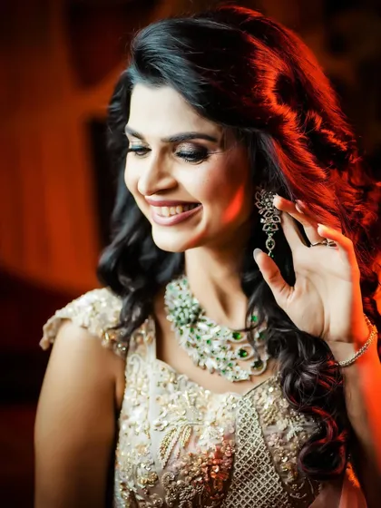 A radiant smile from the bride, with beautiful backlighting.