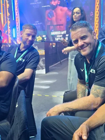 Our coaches enjoying the fights from the sidelines at an MFN event. We are passionate students of the game.