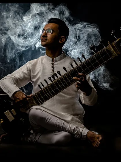 A close-up of the dramatic smoke-filled studio portrait.