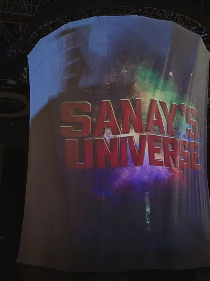 The dramatic reveal of 'Sanay's Universe'. A custom projection on a cylindrical screen created a high-impact opening for this multi-themed birthday extravaganza.