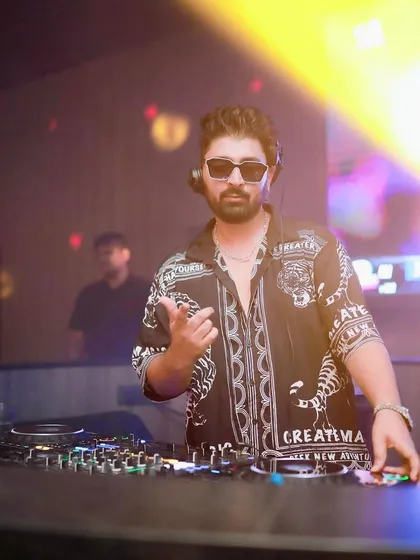 Pointing to the crowd, bringing the energy at Badmaash Sarjapur.