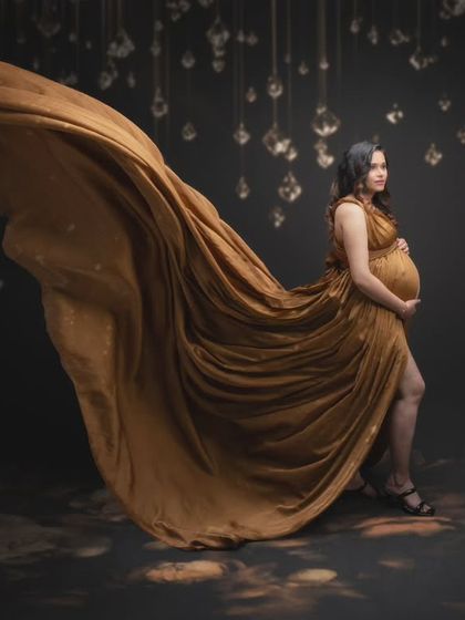 Creating a visual masterpiece. The flow of this stunning golden gown was a product of patience and coordination, creating a majestic yet graceful look.